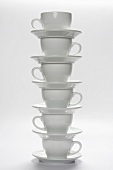 White Coffee Cups and Saucers Stacked