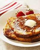 Plate of French Toast with Butter and Syrup; Strawberries