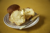 Fresh Baked Bread Roll with Butter; Knife