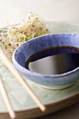 Soy Sauce in Ceramic Bowl with Sprouts