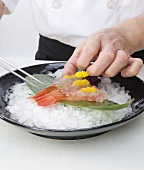 Sushi Chef Serving Santa Barbara Spot Prawn Over Ice on Leaf with Roe