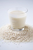 Glass of Rice Milk on Grains of Rice