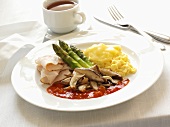 Low-carb Breakfast with Scrambled Eggs, Sliced Turkey, Mushrooms and Asparagus with Tomato Sauce