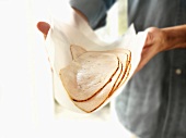 Person Holding Sliced Turkey Breast