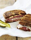 Reuben Sandwich with Pickle on Paper
