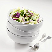 Cucumber Dill Salad with Purple Onion; In Stacked Bowls; Forks