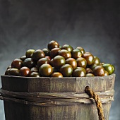 Wooden Barrel Full of Fresh Green Tomatoes