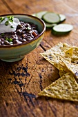 Black Bean Dip and Tortilla Chips on a Wooden Table