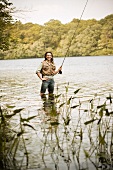 Woman with Fly Rod in River