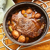Pot Roast with Potatoes and Vegetables in a Pot
