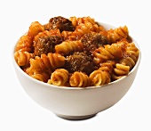 Fusilli Pasta with Meatballs in a White Bowl; White Background 