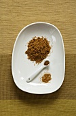 Cumin on Ceramic Dish and Measuring Spoon