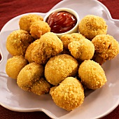 Fried Mushrooms with Ketchup on a Purple Dish