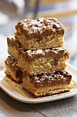 Squares of Maple Coffee Cake Stacked on a Plate