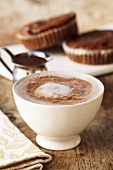 Cup of Hot Chocolate on Wooden Table; Brownies