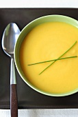 Bowl of Acorn Squash Soup with Chive Garnish; From Above