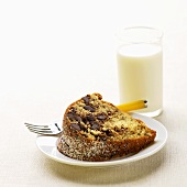 Slice of Chocolate Chip Bundt Cake on a Plate; Glass of Milk