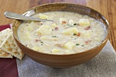 Bowl of New England Clam Chowder; Spoon; Crackers
