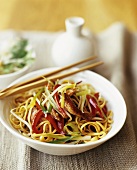 Chicken and Vegetable Stir Fry Over Noodles; Chopsticks