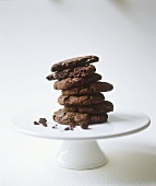 Chocolate Cookies Stacked on White Pedestal Dish