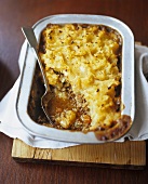 Cottage Pie in Baking Dish with Serving Spoon
