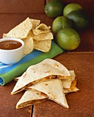 Quesadillas with Tortilla Chips and Dipping Sauce; Limes
