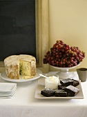 Brownies; Grapes; Stilton Cheese; On Table; Serving Plates