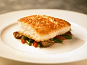 Halibut with a Potato Crust on a Bed of Vegetables