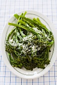 Broccolini Sprinkled with Parmesan Cheese on a Platter
