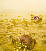 Donuts Splashing into Oil for Deep Frying