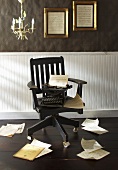 Black Chair with Typewriter; Scattered Papers