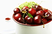 Container of Fresh Red Cherries; Wet