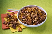 Spicy Snack Mix in a Bowl; Beside Bowl on Napkins