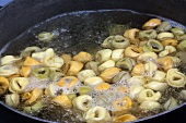 Tri-Colored Tortellini Cooking in a Pot of Boiling Water