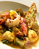 Bowl of Seafood Stew with a Slice of Bread