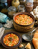 Pot and Bowl of Bean Soup with Ingredients