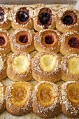 Rows of Filled Danish Pastries on a Baking Sheet