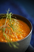 Roasted Fennel and Carrot Soup in a Bowl with Dill Garnish; Close Up