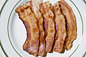 Plate of Cooked Bacon Strips; From Above