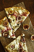 Fig and Pancetta Pizza Slices on Cutting Board