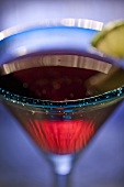 Cosmopolitan in a Blue Martini Glass with Lime Garnish; Close Up