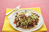 Beef and Bean Taco Salad on a Tortilla