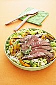 Steak Salad with Grilled Orange Slices in a Green Bowl