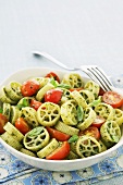 Pesto Wagon Wheels with Cherry Tomatoes in a Bowl with a Fork
