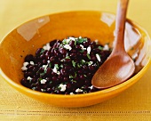 Black Beans and Feta Cheese in a Bowl with a Wooden Spoon