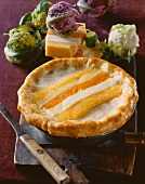 Cauliflower and Cheddar Quiche; Knife and Fresh Ingredients