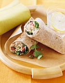 Tuna wraps with tomatoes, salad and capers