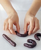 Hands Shaping Chocolate Dough