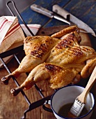 Butterflied and Grilled Chicken; Basting Sauce and Brush in a Bowl