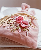 A fabric bag with a floral motive (for jewellery)